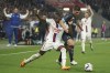 Lyon's Castello Lukeba, left, challenges for the ball with Marseille's Isaak Toure during the French League One soccer match between Lyon and Marseille at the Groupama stadium, in Decines, near Lyon, France, Sunday, April 23, 2023. (AP Photo/Laurent Cipriani)
