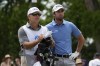 Davis Riley talks to his caddie on the 8th tee during the final round of the PGA Zurich Classic golf tournament at TPC Louisiana in Avondale, La., Sunday, April 23, 2023. (AP Photo/Gerald Herbert)
