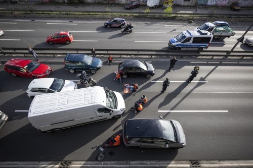 The A100 is blocked with a sit-in by activists of the group Last Generation in Berlin Monday, April 24, 2023. German climate activists tried bringing traffic to a standstill in Berlin on Monday morning by gluing themselves to streets all over the capital. (Hannes Albert/dpa via AP)