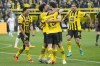 Dortmund's Mats Hummels, center, is celebrated by his team and scorer Jude Bellingham, left, after scoring his side's third goal during the German Bundesliga soccer match between Borussia Dortmund and Eintracht Frankfurt in Dortmund, Germany, Saturday, April 22, 2023. (AP Photo/Martin Meissner)