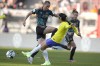 Germany's Klara Buehl, left, challenges for the ball with Brazil's Antonia Silva during the women's international soccer friendly match between Germany and Brazil, at the Max Morlock stadium in Nuremberg, Germany, Tuesday, April 11, 2023. (AP Photo/Matthias Schrader)