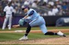 Toronto Blue Jays relief pitcher Adam Cimber (90) throws in the ninth inning of a baseball game against the New York Yankees, Sunday, April 23, 2023, in New York. Cimber was placed on the 15-day injured list by the Toronto Blue Jays on Monday. THE CANADIAN PRESS/AP-John Minchillo