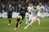 Atalanta's Ederson, left, and Roma's Roger Ibanez battle for the ball during the Serie A soccer match between Atalanta and Roma at Gewiss Stadium in Bergamo, Italy, Monday April 24, 2023. (Simone Spada/LaPresse via AP)