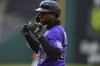 Colorado Rockies' Jurickson Profar celebrates after hitting a two-RBI single against the Cleveland Guardians during the fourth inning of a baseball game, Monday April 24, 2023, in Cleveland. (AP Photo/David Dermer)