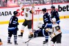 Vegas Golden Knights' William Karlsson (71) celebrates his goal on Winnipeg Jets' goaltender Connor Hellebuyck (37) during second period game 4 NHL Stanley Cup first round hockey playoff action in Winnipeg, Monday, April 24, 2023. THE CANADIAN PRESS/Fred Greenslade