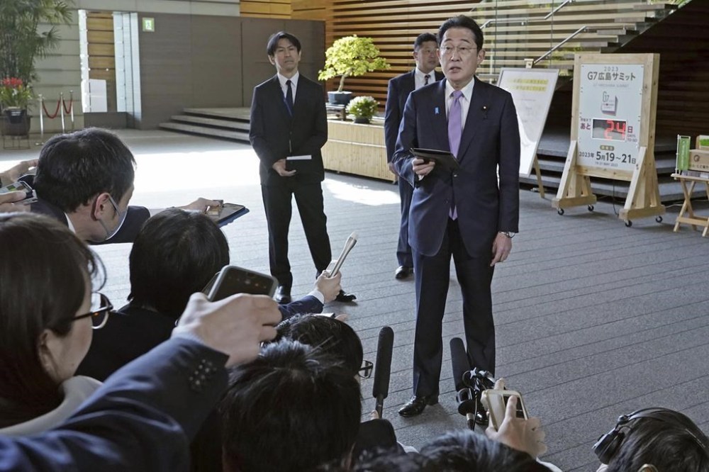 Japanese Prime Minister Fumio Kishida speaks to the media at his office in Tokyo Tuesday, April 25, 2023 after an evacuation of its citizens from Sudan was completed. Kishida said all the Japanese nationals who had expressed intensions to be evacuated so far have safely left Sudan, but Foreign Ministry officials will stay in Djibouti to provide support in case evacuation is needed additionally. (Kyodo News via AP)