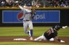 Kansas City Royals second baseman Michael Massey, left, gets the force out against Arizona Diamondbacks' Gabriel Moreno (14) on a ball hit by Jake McCarthy in the sixth inning during a baseball game, Monday, April 24, 2023, in Phoenix. (AP Photo/Rick Scuteri)