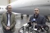 Swiss Federal Councilor Ignazio Cassis, right, with Christian Winter, left, Swiss Ambassador of Sudan, speaks during a press conference at the Bern-Belp Airport in Belp, Switzerland, Tuesday, April 25, 2023. Swiss nationals are flown out of the crisis area in Sudan. (Peter Schneider/Keystone via AP, Pool)