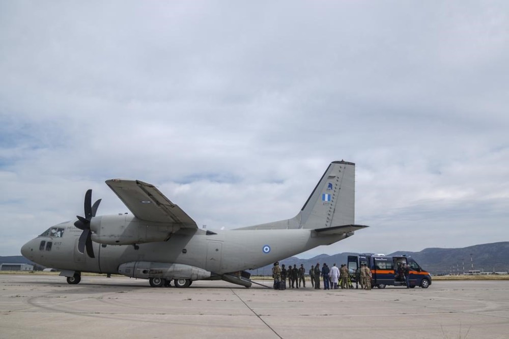 Passengers from Sudan disembark a military plane at Elefsina Air Force Base, in western Athens, Greece, on Tuesday, April 25, 2023. As continued fighting raises fears that Sudan could plunge deeper into chaos, foreign governments are scrambling to get their diplomats and other citizens safely out. (AP Photo/Petros Giannakouris)