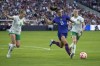 United States' Alex Morgan (13) chases after the ball as Ireland's Ruesha Littlejohn (8) and Megan Connolly (6) defend during the first half of an international friendly soccer match Tuesday, April 11, 2023, in St. Louis. (AP Photo/Jeff Roberson)