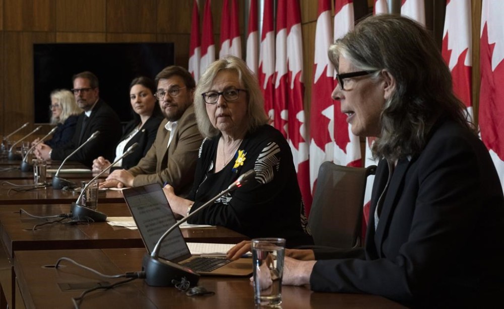 Physicist Ginette Charbonneau, NDP MP Alexandre Boulerice, Liberal MP Jenica Atwin, Bloc Quebecois MP Mario Simard and Green Party MP Elizabeth May listen to Coalition for Responsible Energy Development in New Brunswick’s Susan O’Donnell speak during a news conference in Ottawa, Tuesday, April 25, 2023. THE CANADIAN PRESS/Adrian Wyld