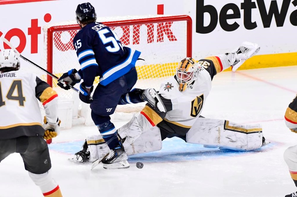 Vegas Golden Knights goaltender Laurent Brossoit (39) makes a save on Winnipeg Jets' Mark Scheifele (55) during first period game 4 NHL Stanley Cup first round hockey playoff action in Winnipeg, Monday April 24, 2023. The team's top goal-scorer, who left Monday’s 4-2 playoff loss to the Golden Knights with an upper-body injury, still remains a question mark for Thursday’s critical Game 5 with Vegas up 3-1 in the best-of-seven, first-round series. THE CANADIAN PRESS/Fred Greenslade