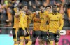 Wolverhampton Wanderers players celebrate after Crystal Palace's Joachim Andersen, not pictured, scored an own goal during the English Premier League soccer match between Wolverhampton Wanderer's and Crystal Palace at Molineux Stadium, Wolverhampton, England, Tuesday, April 25, 2023. (Nick Potts/PA via AP)