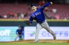 Texas Rangers' Cole Ragans throws during the eighth inning of the team's baseball game against the Cincinnati Reds in Cincinnati, Tuesday, April 25, 2023. The Reds won 7-6. (AP Photo/Aaron Doster)
