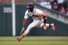 Atlanta Braves' Ronald Acuna Jr. slides into second base with a double against the Miami Marlins during the first inning of a baseball game Tuesday, April 25, 2023, in Atlanta. (AP Photo/John Bazemore)