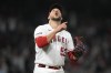 Los Angeles Angels relief pitcher Carlos Estevez (53) celebrates after a 5-3 win over the Oakland Athletics in a baseball game in Anaheim, Calif., Tuesday, April 25, 2023. (AP Photo/Ashley Landis)