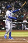 Kansas City Royals' Franmil Reyes watches his RBI sacrifice fly during the fifth inning of the team's baseball game against the Arizona Diamondbacks, Tuesday, April 25, 2023, in Phoenix. (AP Photo/Rick Scuteri)