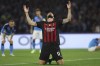 Milan's Olivier Giroud celebrates scoring their side's first goal of the game during the Champions League quarterfinal second leg soccer match between Napoli and Milan, at Naples' Diego Armando Maradona stadium, in Napoli, Tuesday April 18, 2023. (Alessandro Garofalo/LaPresse via AP)