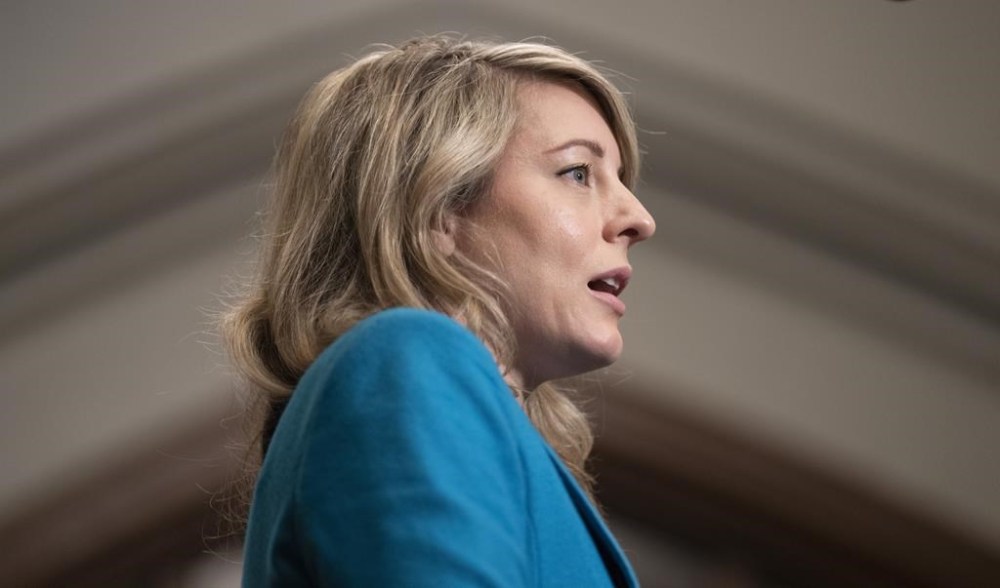 Foreign Affairs Minister Melanie Joly speaks with reporters as she heads to a meeting of cabinet on Parliament Hill in Ottawa, Tuesday, April 25, 2023. Joly says another 50 Canadians were evacuated out of Sudan in the past day. THE CANADIAN PRESS/Adrian Wyld