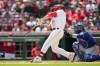 Cincinnati Reds' Nick Senzel hits a game winning two-run home run against the Texas Rangers in the ninth inning of a baseball game in Cincinnati, Wednesday, April 26, 2023. (AP Photo/Jeff Dean)