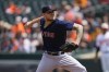 Boston Red Sox starting pitcher Tanner Houck throws a pitch to the Baltimore Orioles during the first inning of a baseball game, Wednesday, April 26, 2023, in Baltimore. (AP Photo/Julio Cortez)