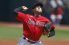 Cleveland Guardians starting pitcher Tanner Bibee throws in his major league debut against the Colorado Rockies during the first inning of a baseball game, Wednesday, April 26, 2023, in Cleveland. (AP Photo/Ron Schwane)