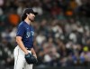 Seattle Mariners starting pitcher Robbie Ray reacts after walking Cleveland Guardians' Josh Bell during the first inning of a baseball game Friday, March 31, 2023, in Seattle. (AP Photo/Lindsey Wasson)