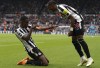 Newcastle United's Alexander Isak, left, celebrates scoring their side's fourth goal of the game with team-mate Joe Willock during the English Premier League soccer match between Newcastle United and Tottenham at St. James' Park, Newcastle upon Tyne, England, Sunday, April 23, 2023. (Owen Humphreys/PA via AP)