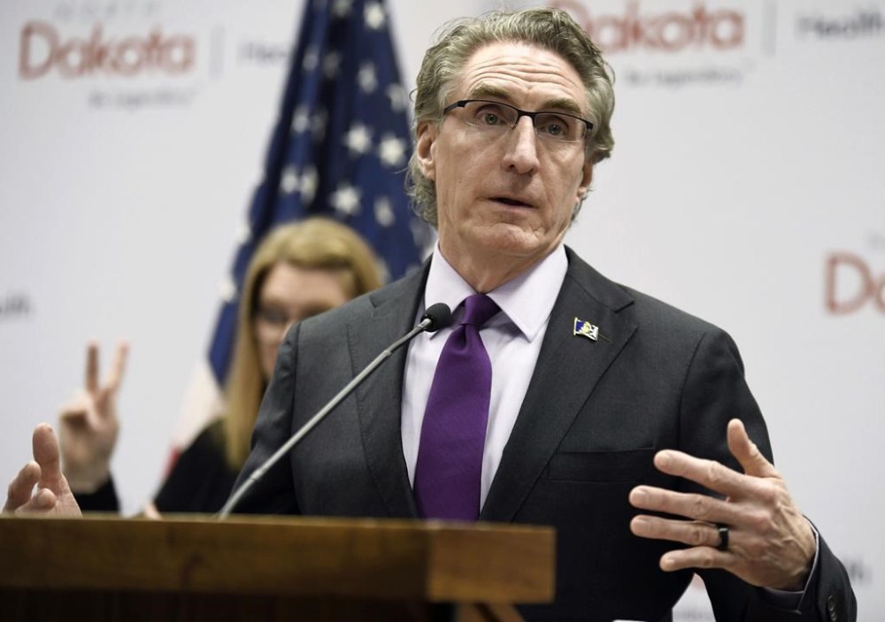 FILE - North Dakota Gov. Doug Burgum speaks at the state Capitol on April 10, 2020, in Bismarck, N.D. Burgum has vetoed a bill Wednesday, April 26, 2023, that would have criminalized librarians for willfully displaying sexually explicit materials, and signed a bill that prohibits those materials in children's sections of local and school libraries. (Mike McCleary/The Bismarck Tribune via AP, File)