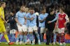 Manchester City's Kyle Walker, center, celebrates with teammate Erling Haaland at the end of the English Premier League soccer match between Manchester City and Arsenal at Etihad stadium in Manchester, England, Wednesday, April 26, 2023. Manchester City won 4-1. (AP Photo/Dave Thompson)