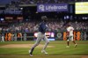 Seattle Mariners' J.P. Crawford, left, rounds the bases after hitting a grand slam against Philadelphia Phillies pitcher Taijuan Walker during the second inning of a baseball game, Wednesday, April 26, 2023, in Philadelphia. (AP Photo/Matt Slocum)