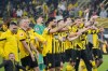 Dortmund players celebrates after defeating Eintracht Frankfurt during the German Bundesliga soccer match between Borussia Dortmund and Eintracht Frankfurt in Dortmund, Germany, Saturday, April 22, 2023. (AP Photo/Martin Meissner)