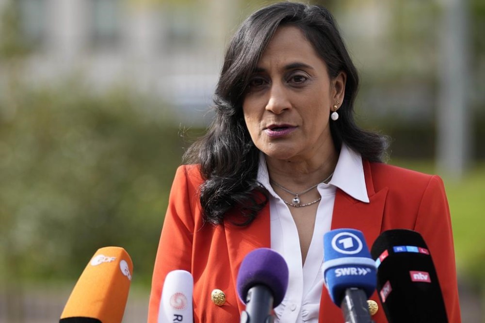 Defence Minister Anita Anand talks to journalists during a press statement prior to the meeting of the 'Ukraine Defense Contact Group' at Ramstein Air Base in Ramstein, Germany, Friday, April 21, 2023. Anand says the first Canadian evacuation flight from Sudan has taken off and additional evacuations are planned over the next few days. THE CANADIAN PRESS/AP/Matthias Schrader