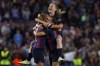 Barcelona's Ana-Maria Crnogorcevic, Laia Codina and Keira Walsh, from left, celebrate at the end of the Women's Champions League semifinal, second leg, soccer match between FC Barcelona and Chelsea FC at the Camp Nou stadium in Barcelona, Spain, Thursday, April 27, 2023. The match ended in a 1-1 draw but Barcelona advance on a 2-1 aggregate. (AP Photo/Joan Monfort)