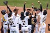 The Pittsburgh Pirates celebrate getting the final out of a 6-2 win over the Los Angeles Dodgers in a baseball game in Pittsburgh, Thursday, April 27, 2023. (AP Photo/Gene J. Puskar)