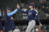 Tampa Bay Rays' Brandon Lowe, left, and Josh Lowe celebrate the team's 14-5 win over the Chicago White Sox in a baseball game on Thursday, April 27, 2023, in Chicago. (AP Photo/Charles Rex Arbogast)