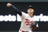 Minnesota Twins starting pitcher Tyler Mahle throws to a Kansas City Royals batter during the first inning of a baseball game Thursday, April 27, 2023, in Minneapolis. (AP Photo/Bruce Kluckhohn)