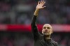 Manchester City's head coach Pep Guardiola greets fans at the end of the English FA Cup semi final soccer match between Manchester City and Sheffield United at Wembley stadium, in London, Saturday, April 22, 2023. (AP Photo/Alastair Grant)