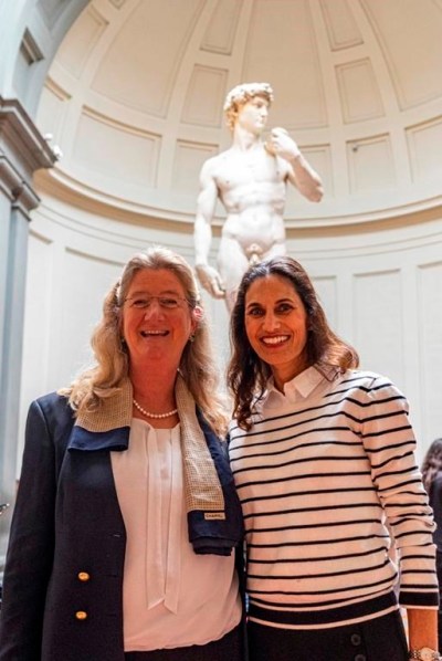 This image provided by Galleria dell'Accademia di Firenze shows former Dean of the Tallahassee Classical School, FL, Hope Carrasquilla, right, posing with Cecilie Hollberg, director of Florence's Galleria dell'Accademia museum in front of Michelangelo Buonarroti's colossal marble statue 'David', in Florence, central Italy, Friday, April 28, 2023. Hollberg invited Carrasquilla after she was forced to resign in March following parental complaints that an image of the nude Renaissance masterpiece was shown to a sixth-grade art class. (Guido Cozzi/Galleria dell'Accademia via AP)