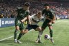 Vancouver Whitecaps FC's Julian Gressel (middle) tries to fight off the check of Portland Timbers' David Ayala (left) and Evander during second half of MLS soccer action in Vancouver, B.C., Saturday, April 8, 2023. After a week off to reflect on their season so far, the Vancouver Whitecaps take on the Colorado Rapids on Saturday.THE CANADIAN PRESS/Rich Lam