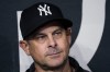 New York Yankees manager Aaron Boone listens to questions from reporters before the team's baseball game against the Texas Rangers, Friday, April 28, 2023, in Arlington, Texas. (AP Photo/Sam Hodde)