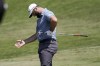 Jon Rahm, of Spain, reacts to missing a putt on the 10th green during the Mexico Open golf tournament's second round in Puerto Vallarta, Mexico, Friday, April 28, 2023. (AP Photo/Moises Castillo)