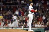 Boston Red Sox's Kutter Crawford stands on the mound after giving up a solo home run to Cleveland Guardians' Will Brennan, back left, during the ninth inning of a baseball game, Friday, April 28, 2023, in Boston. (AP Photo/Michael Dwyer)