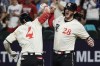 Texas Rangers' Robbie Grossman (4) celebrates with Jonah Heim (28) after hitting a two-run home run during the third inning of the team's baseball game against the New York Yankees, Friday, April 28, 2023, in Arlington, Texas. (AP Photo/Sam Hodde)