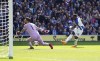 Brighton's Danny Welbeck shoots towards goal as Wolverhampton Wanderers goalkeeper Jose Sa saves, during the English Premier League soccer match between Brighton & Hove and Wolverhampton Wanderers, at the AMEX Stadium, Brighton, England, Saturday April 29, 2023. (Adam Davy/PA via AP)
