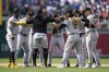 Members of the Pittsburgh Pirates celebrate after winning the first baseball game of a doubleheader against the Washington Nationals, Saturday, April 29, 2023, in Washington. Pittsburgh won 6-3. (AP Photo/Patrick Semansky)
