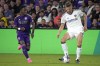 LA Galaxy's Eriq Zavaleta, right, looks to pass the ball as Orlando City's Ivan Angulo, left, comes in during the second half of an MLS soccer match, Saturday, April 29, 2023, in Orlando, Fla. (AP Photo/John Raoux)