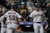 Arizona Diamondbacks' Christian Walker and Evan Longoria celebrate Walker's home run against the Colorado Rockies during the ninth inning of a baseball game Saturday, April 29, 2023, in Denver. (AP Photo/Geneva Heffernan)
