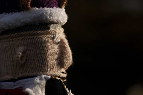 A vies of a knitted figure of Britain's King Charles III made by members of the 'Hurst Hookers' knitting group after its fitting to a post during a pre-coronation 'yarn bombing' in the village of Hurst, near Reading, England, Friday, April 21, 2023. Heather Howarth and her friends in the village of Hurst, a stone’s throw from Reading, west of London, have fashioned a woolly coronation procession to rival the pomp and circumstance that will take place when Charles is crowned on May 6 at Westminster Abbey. (AP Photo/David Cliff)