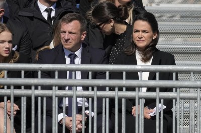 Hungary President Katalin Novak, right, waits for Pope Francis arrival for a mass in Kossuth Lajos Square in Budapest, Hungary, Sunday, April 30, 2023. (AP Photo/Andrew Medichini)